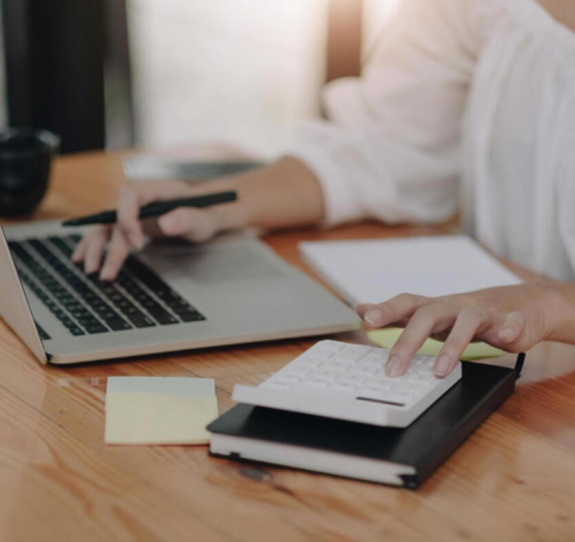 Bookkeeper reviewing financial reports in QuickBooks and advising small business client
